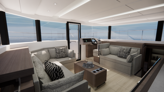 Le reste du pont principal avec un coin salon sur tribord, un carré convertible pour des repas en intérieur et un poste de pilotage à l'avant tribord